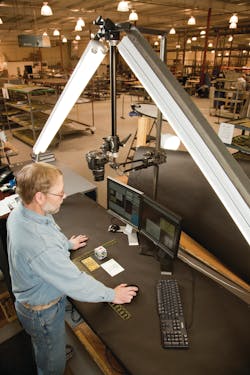 As part of its contract with the Center for Aircraft Structural Life Extension (CAStLE), Sabreliner conducted a two-year structural teardown of the KC-135E. Here, a Sabreliner employee takes a high-resolution photo of a KC-135 part. As part of its contract with the Center for Aircraft Structural Life Extension (CAStLE), Sabreliner conducted a two-year structural teardown of the KC-135E. Here, a Sabreliner employee takes a high-resolution photo of a KC-135 part.