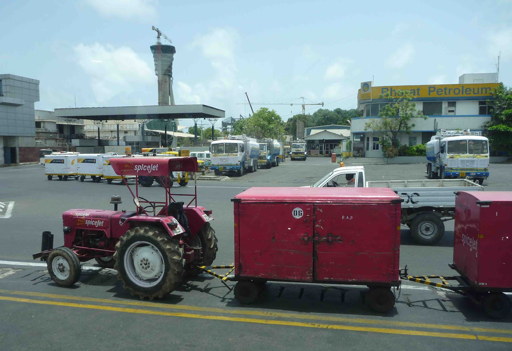 Farm tractors are still used at airports in India.