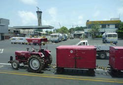 Farm tractors are still used at airports in India. Farm tractors are still used at airports in India.