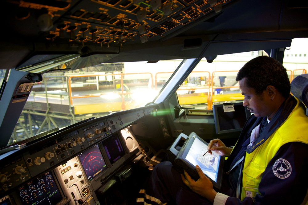 Technicians at Lufthansa Technik analyze aircraft operating data using tablet computers, a trend the industry will see more of.
