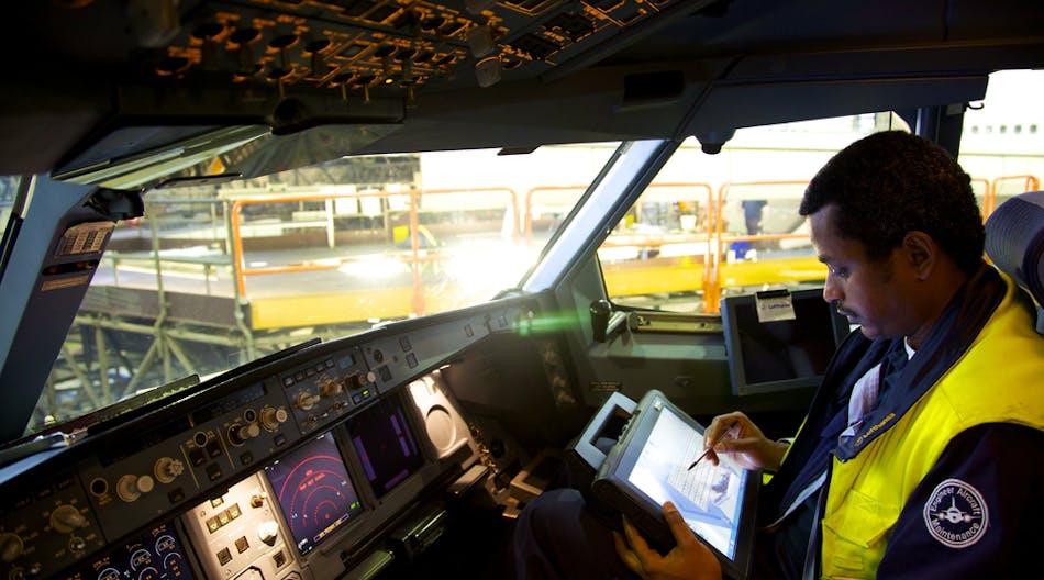 Technicians at Lufthansa Technik analyze aircraft operating data using tablet computers, a trend the industry will see more of.