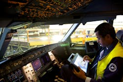 Technicians at Lufthansa Technik analyze aircraft operating data using tablet computers, a trend the industry will see more of.