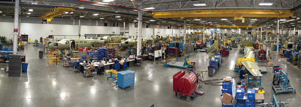 Workers assemble new airplanes on the factory floor at Cessna Aircraft Company in Wichita, KS.
