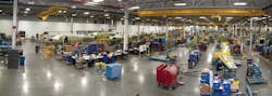 Workers assemble new airplanes on the factory floor at Cessna Aircraft Company in Wichita, KS. Workers assemble new airplanes on the factory floor at Cessna Aircraft Company in Wichita, KS.