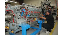 Juan Rodgriguez, a Redstone College student, works on a reciprocating engine, a core part of the A&amp;P training.