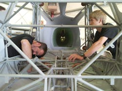 Mark Van Tine, president of Jeppesen, and Wyatt Johansen, a student from Canby High School, work together on the Build A Plane project.