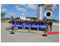 Rolls-Royce Outdoor Jet Engine Test Facility employees stand in front of the new, second test stand which was dedicated today. The stand recently began running a production Trent XWB – and on Oct. 15, 2013 – both stands were operational for the first time concurrently. Rolls-Royce Outdoor Jet Engine Test Facility employees stand in front of the new, second test stand which was dedicated today. The stand recently began running a production Trent XWB – and on Oct. 15, 2013 – both stands were operational for the first time concurrently.