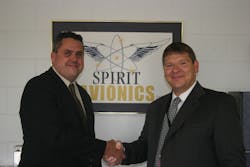 Justin Hahn (on the left) is congratulated by Spirit President Tony Bailey (on the right).