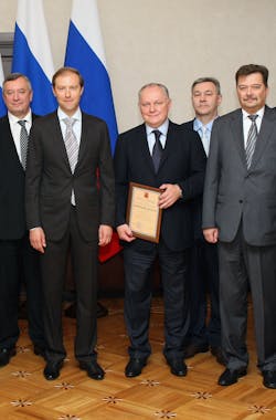 Minister of Industry and Trade Denis Manturov (second left), Russian Helicopters CEO Alexander Mikheev (third left, holding the certificate).