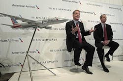 Doug Parker, left, of U.S. Air and Tom Horton of American Airlines discuss the merger of the two airlines in February.