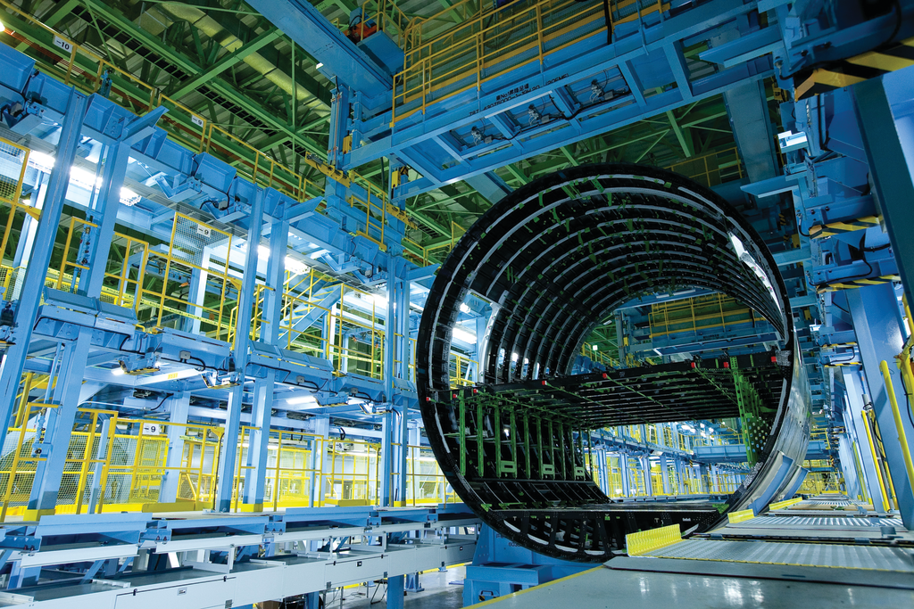 B787 fuselage sections, fixtures, and tooling during production.