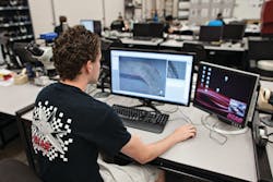 Student assistant Miguel Correa performs radius measurements on inter-laminate tension coupons in the Composites Laboratory at Wichita State University's National Institute for Aviation Research. Student assistant Miguel Correa performs radius measurements on inter-laminate tension coupons in the Composites Laboratory at Wichita State University's National Institute for Aviation Research.