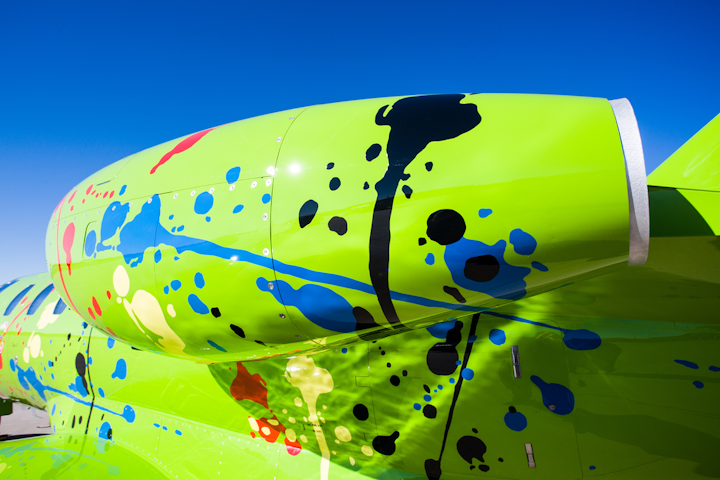 The paint team very carefully and precisely taped these seemingly careless paint splotches to give the aircraft an organized chaos look.