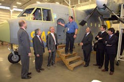 John Gordon, center, lead mechanic for Airbus Military in Mobile shows a refurbished C212 aircraft in the hanger. Also pictured from left to right are Frazier Payne, aid for U.S. Rep. Bradley Byrne , Juan Uriarte, Philippe Galland, John Gordon, Jose Morales, Alvaro Martinez-Avial and Jose Miguel Perez, all of Airbus.