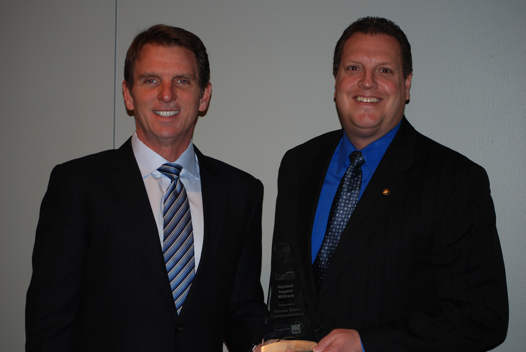 Satcom Direct President David Greenhill and Vice President for Business Development Dale Holland accept Via Satellite's Vertical Impact for Military Excellence Award.