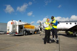 Shell Aviation staff finalising a refueling transaction Shell Aviation staff finalising a refueling transaction