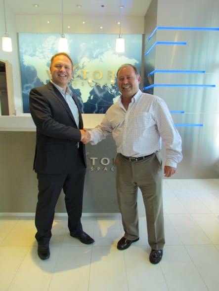 Toby Gauld President Optima Aero And Greg Mant Regional Sales Manager Eastern Canada Vector Aerospace Shake Hands After Signing Agreement