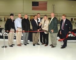Ceremonial ribbon cutting to commemorate the opening of the new facility. Pictured, from left to right, Samuel Haycraft, Cofounder/Executive Vice President, West Star Aviation Inc.; Michael Durst, Cofounder/Executive Vice President Inc., West Star Aviation; Robert Rasberry, CEO, West Star Aviation Inc.; Eric Kujawa, General Manager (ALN), West Star Aviation Inc.; Jim Swehla, Cofounder/Executive Vice President, West Star Aviation Inc.; Darrell McGibany, Chairman, St. Louis Regional Airport Authority Board of Commissioners; Steve Kochan, Secretary, St. Louis Regional Airport Authority Board of Commissioners, St. Louis Regional Airport Authority; Dave Miller, Manager, St. Louis Regional Airport.