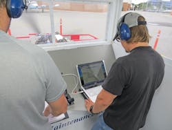 Students analyzing faults with a laptop on a FADEC diesel engine. Students analyzing faults with a laptop on a FADEC diesel engine.