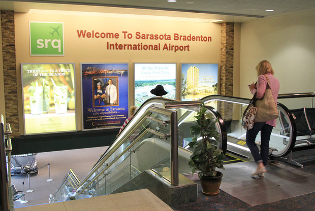 A large wall over the down escalator to baggage claim at Sarasota Bradenton International Airport could be home to a giant, high-resolution screen that would host advertising potentially worth hundreds of thousands of dollars to the airport.