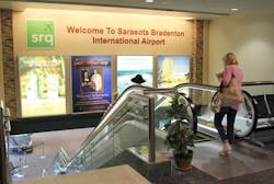 A large wall over the down escalator to baggage claim at Sarasota Bradenton International Airport could be home to a giant, high-resolution screen that would host advertising potentially worth hundreds of thousands of dollars to the airport.