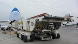 The special cargo loader weighed 109,000 kgs. At 33.13 m long, 6.08 m wide and 3.44 m high, it was one of the largest and heaviest pieces ever carried in the giant An-124, and fitted the aircraft with only 10cm clearance. The special cargo loader weighed 109,000 kgs. At 33.13 m long, 6.08 m wide and 3.44 m high, it was one of the largest and heaviest pieces ever carried in the giant An-124, and fitted the aircraft with only 10cm clearance.