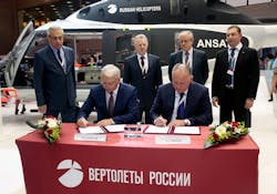 KRET CEO Nikolay Kolesov (left) and Russian Helicopters CEO Alexander Mikheev (right). KRET CEO Nikolay Kolesov (left) and Russian Helicopters CEO Alexander Mikheev (right).