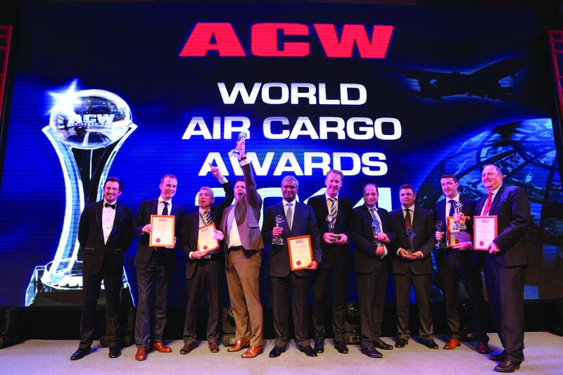 Swissport staff celebrate award during the Air Cargo China 2014 show in Shanghai.