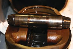 Varnish like substance on this Continental IO-550N piston and pin can lead to deposits and sludge. This engine was on a Cirrus SR-22, reported to have an average oil change interval of 55 hours, 400 hours since top overhaul, and no oil additives. Varnish like substance on this Continental IO-550N piston and pin can lead to deposits and sludge. This engine was on a Cirrus SR-22, reported to have an average oil change interval of 55 hours, 400 hours since top overhaul, and no oil additives.
