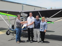 FAA Aviation Safety Inspectors John Soltis (L) and Kym Robbins (R), hand pink airworthiness certificate to Quicksilver Aeronautics principals Will Escutia (white shirt) and Dan Perez at the French Valley Airport. FAA Aviation Safety Inspectors John Soltis (L) and Kym Robbins (R), hand pink airworthiness certificate to Quicksilver Aeronautics principals Will Escutia (white shirt) and Dan Perez at the French Valley Airport.