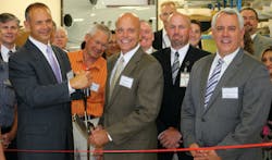 Western Aircraft Celebrates Expansion with Ribbon Cutting Ceremony: Pictured with scissors: President of Western Aircraft Jeff Mihalic, President and CEO of Greenwich AeroGroup Jim Ziegler.