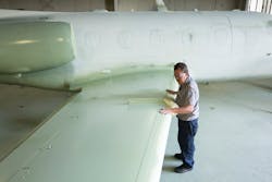 After each application of paint the entire aircraft surface is thoroughly inspected for any minor imperfections that could affect the quality of the final product.