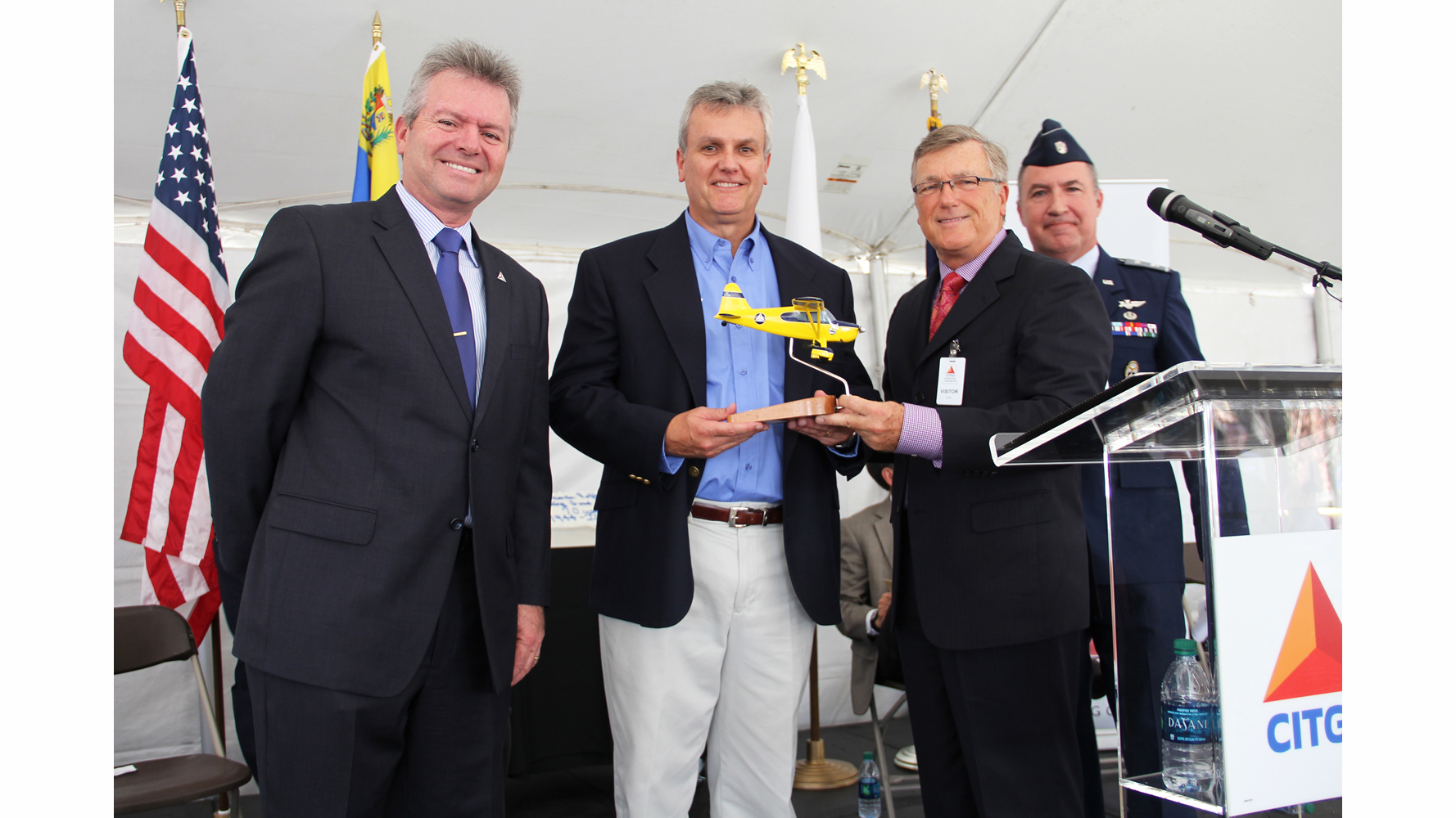 Don Rowland, CAP chief operating officer, presents a replica of a CAP World War II Stinson to Eduardo Assef, CITGO vice president, refining, in appreciation for its sponsorship of the Congressional Gold Medal that CAP will receive in Washington, DC.