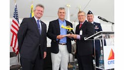 Don Rowland, CAP chief operating officer, presents a replica of a CAP World War II Stinson to Eduardo Assef, CITGO vice president, refining, in appreciation for its sponsorship of the Congressional Gold Medal that CAP will receive in Washington, DC. Don Rowland, CAP chief operating officer, presents a replica of a CAP World War II Stinson to Eduardo Assef, CITGO vice president, refining, in appreciation for its sponsorship of the Congressional Gold Medal that CAP will receive in Washington, DC.
