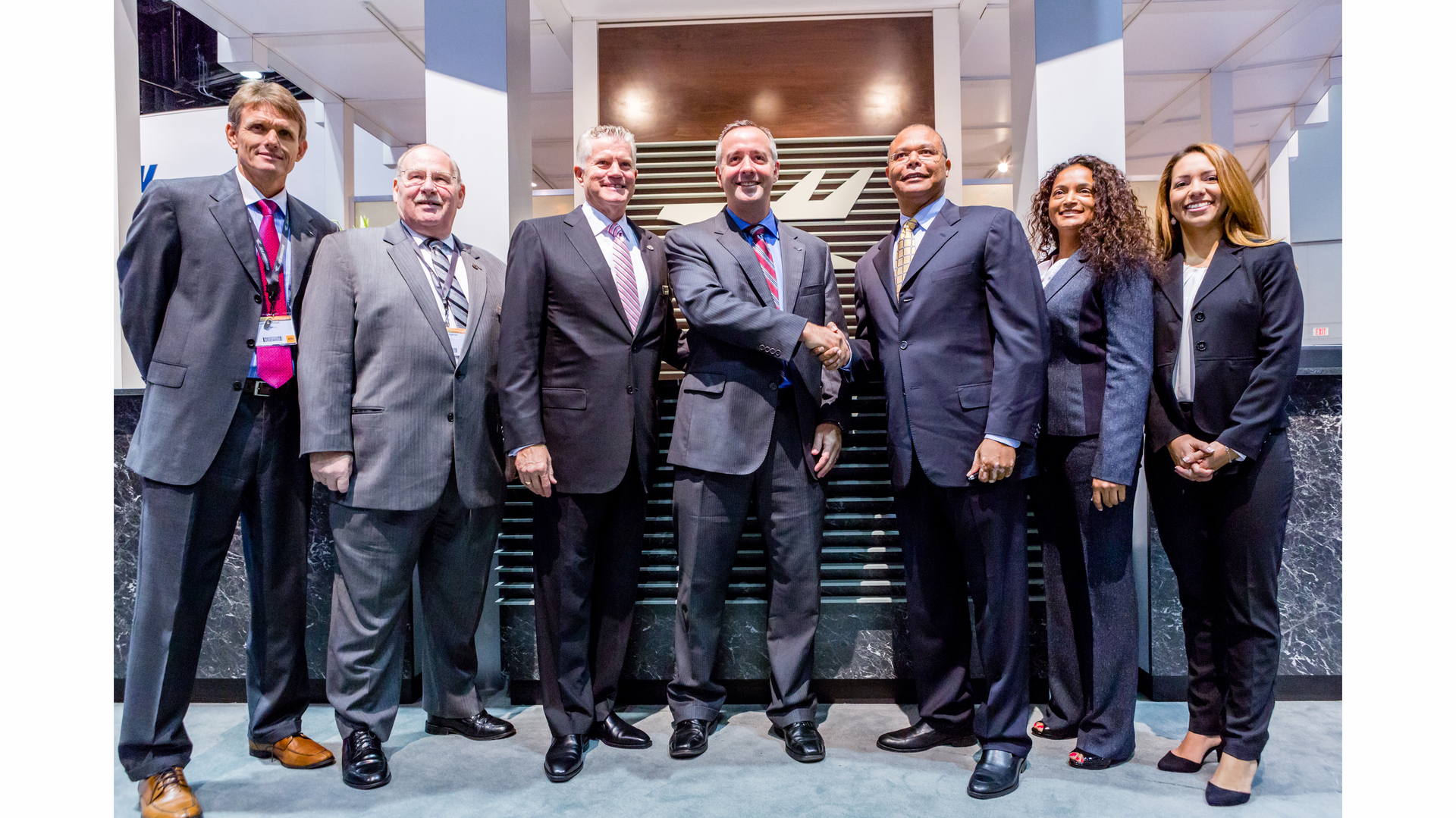 Left to right: Norbert Ehrich; John Langevin; Gary Dempsey; Robert Smith, President, Jet Aviation Group; Alphonso Bowe, EFS; Ursula Garell; and Heimy Fisher.
