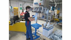 Value-Added Packaging Operator Viktor Merklinger fills a SEMKIT(R) package with high-performance, lightweight aerospace sealant on new equipment at PPG Industries&rsquo; (NYSE:PPG) Central Europe application support center in Hamburg, Germany.