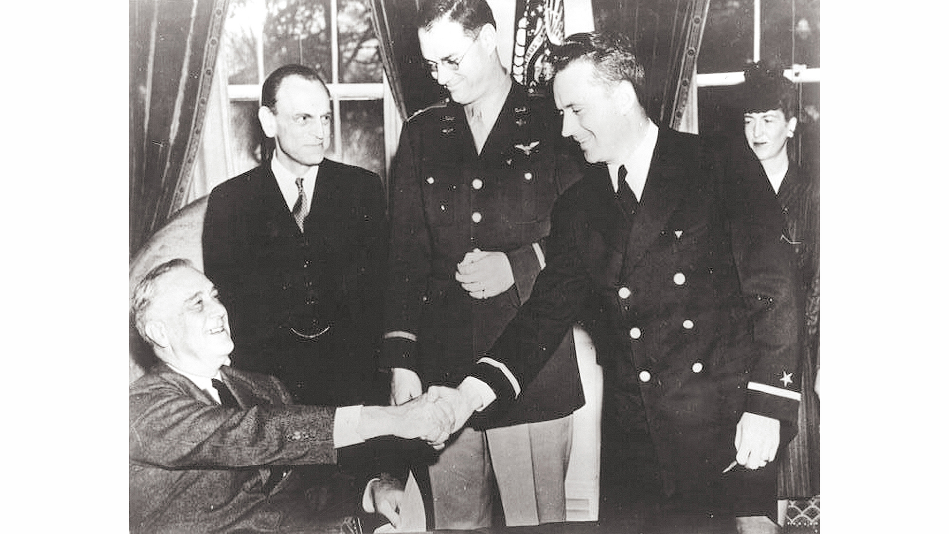 President Franklin D. Roosevelt presents the nation&rsquo;s first-ever Air Medals, given for valor in flight, to a pair of CAP subchasers &ndash; Maj. Hugh R. Sharp, center, and 1st Lt. Edmund &ldquo;Eddie&rdquo; Edwards, second from right, in the Oval Office in February 1943.