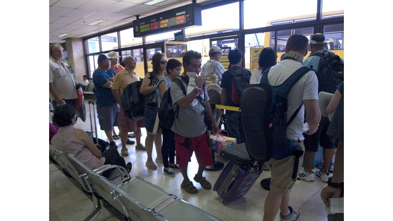 Eventually a pattern emerged. The first person in line should be in the back row, window seat (on either side of the plane). The next person would be in a window seat, two rows up. The line should proceed this way.