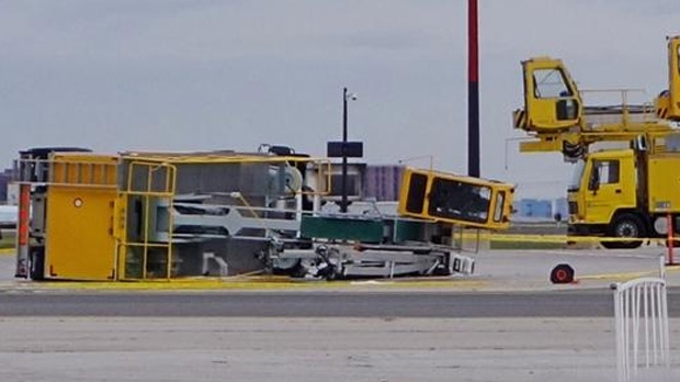 Police received the call around 7:50 a.m. after a deicing truck carrying two employees flipped over for unknown reasons at the airport.