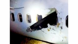 Rough landing reportedly caused a blade to break off the plane's right propeller, sending it flying into the plane, where it sliced through the cabin wall. Rough landing reportedly caused a blade to break off the plane's right propeller, sending it flying into the plane, where it sliced through the cabin wall.