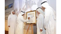 His Highness Sheikh Ahmed bin Saeed Al Maktoum, President of DCAA, Chairman of Dubai Airports and Chairman and Chief Executive of Emirates Airline and Group signing the first day cover of the commemorative stamps.