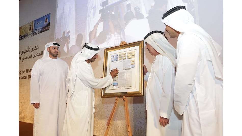 His Highness Sheikh Ahmed bin Saeed Al Maktoum, President of DCAA, Chairman of Dubai Airports and Chairman and Chief Executive of Emirates Airline and Group signing the first day cover of the commemorative stamps.