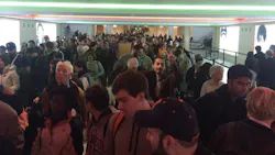 A passenger tweeted: 'The line for TSA at Midway airport leaves the terminal, goes to city train stop, turns around and goes back in.'