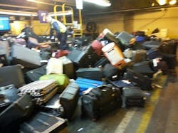 Baggage carousel stands empty while flights continue to arrive. At other times, there were so many bags on the carousel that they were falling onto the floor. Baggage carousel stands empty while flights continue to arrive. At other times, there were so many bags on the carousel that they were falling onto the floor.