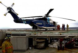 A Cougar Helicopters Sikorsky S-92 helicopter is seen on the helideck of an offshore oil rig on the Grand Banks of Newfoundland in this undated file picture.