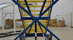 Crew access stairs with automatically locking X-braces increase safety by eliminating a task that could be forgotten by inexperienced ground crews.