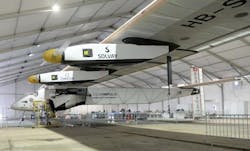 A support team member works on Solar Impulse 2, the world&apos;s only solar powered aircraft, at Sardar Vallabhbhai Patel International Airport in the Indian city of Ahmedabad on March 17, 2015.