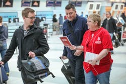 Laura Davis, a national representative of the UNIFOR union, talks with passengers at Pearson International's Terminal 3 about the the passenger service employees who are to lose their jobs at the end of April. Laura Davis, a national representative of the UNIFOR union, talks with passengers at Pearson International's Terminal 3 about the the passenger service employees who are to lose their jobs at the end of April.