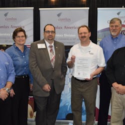 Displaying the Supplemental Type Certificate granted to Comlux America by the FAA are (left to right): Adam Tsakanos of ICG; Kim Stephenson, Senior Manager, Aftermarket Sales, L-3 Corporation; CoryKolman, West Coast Regional Sales Manager for Comlux; Vic Hagner, Avionics Manager for Comlux; Tim Rayl, Senior Vice President, Sales and Marketing for ICG; and Bruce Bunevich, Great Lakes Regional Sales Manager for Universal Avionics.