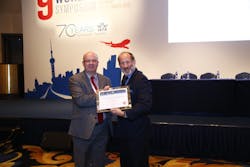Rupert Batstone, VP Business Support Swissport Cargo Services, receiving the certificate at the World Cargo Symposium in Shanghai in March 2015.